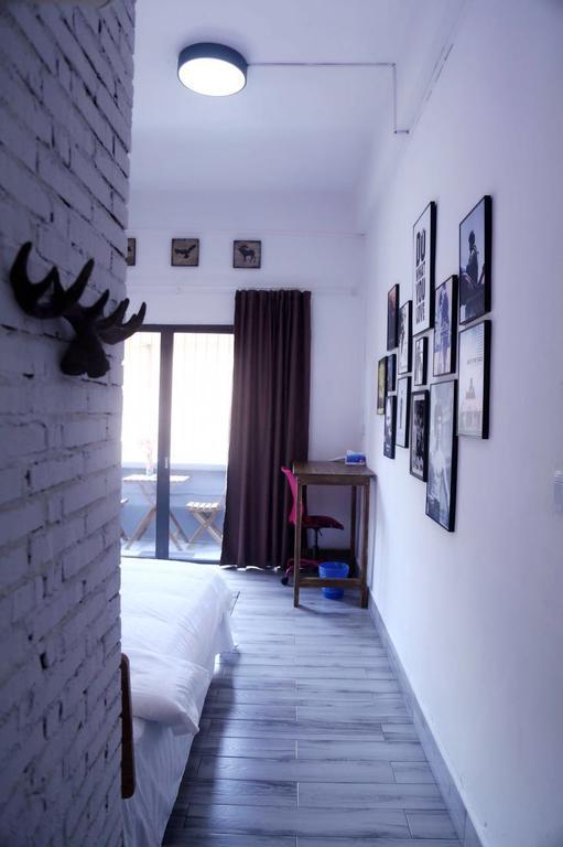 Zhaohuaxishi Youth Hostel Cantón Exterior foto